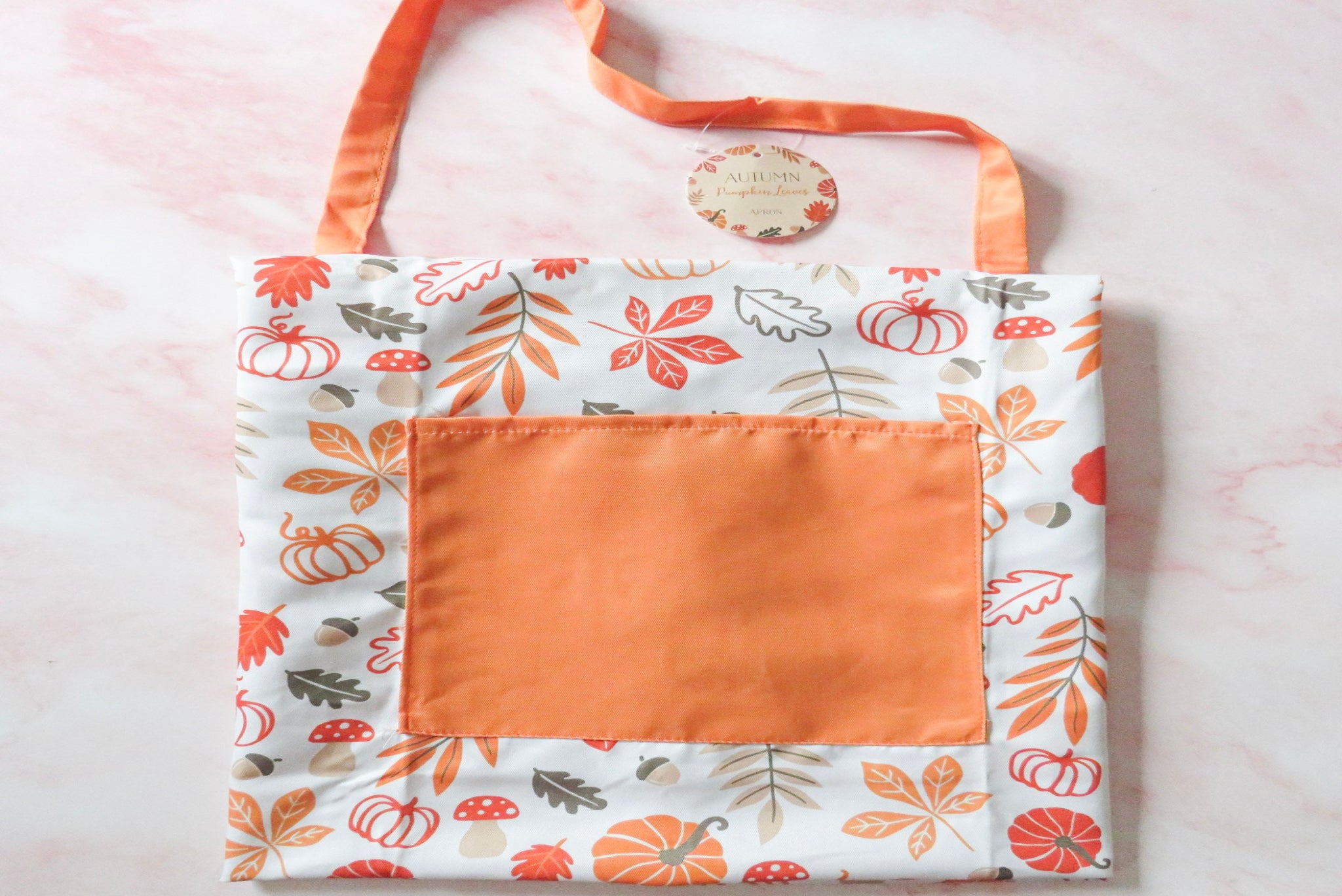 Autumn apron with autumnal design.