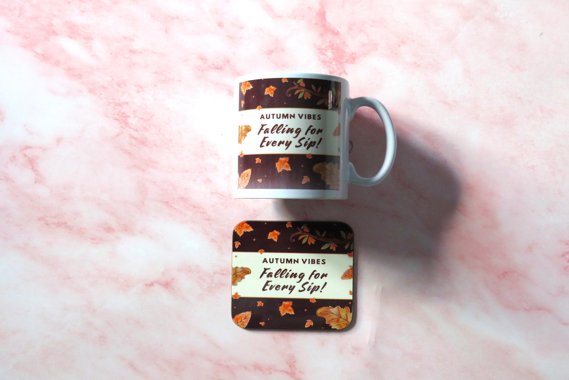 Mug and coaster set with autumn-themed design.