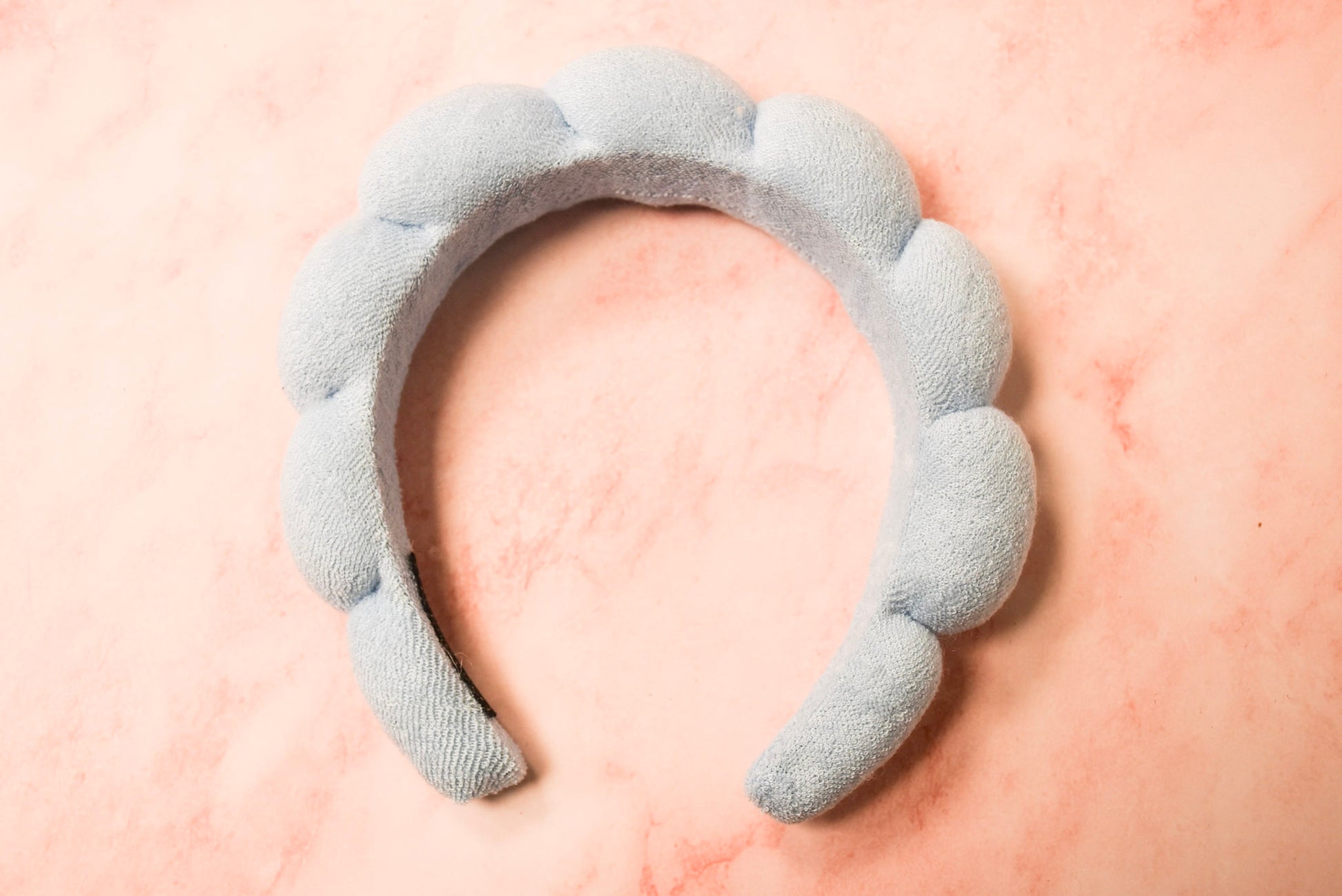 A blue headband with a bubble pattern.