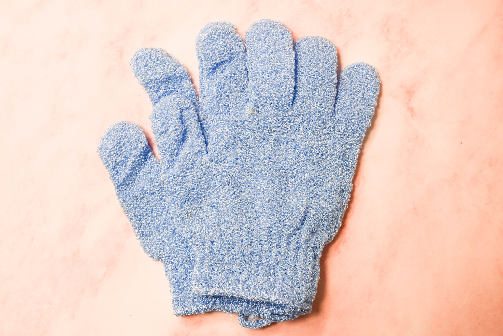 A pair of blue spa gloves.