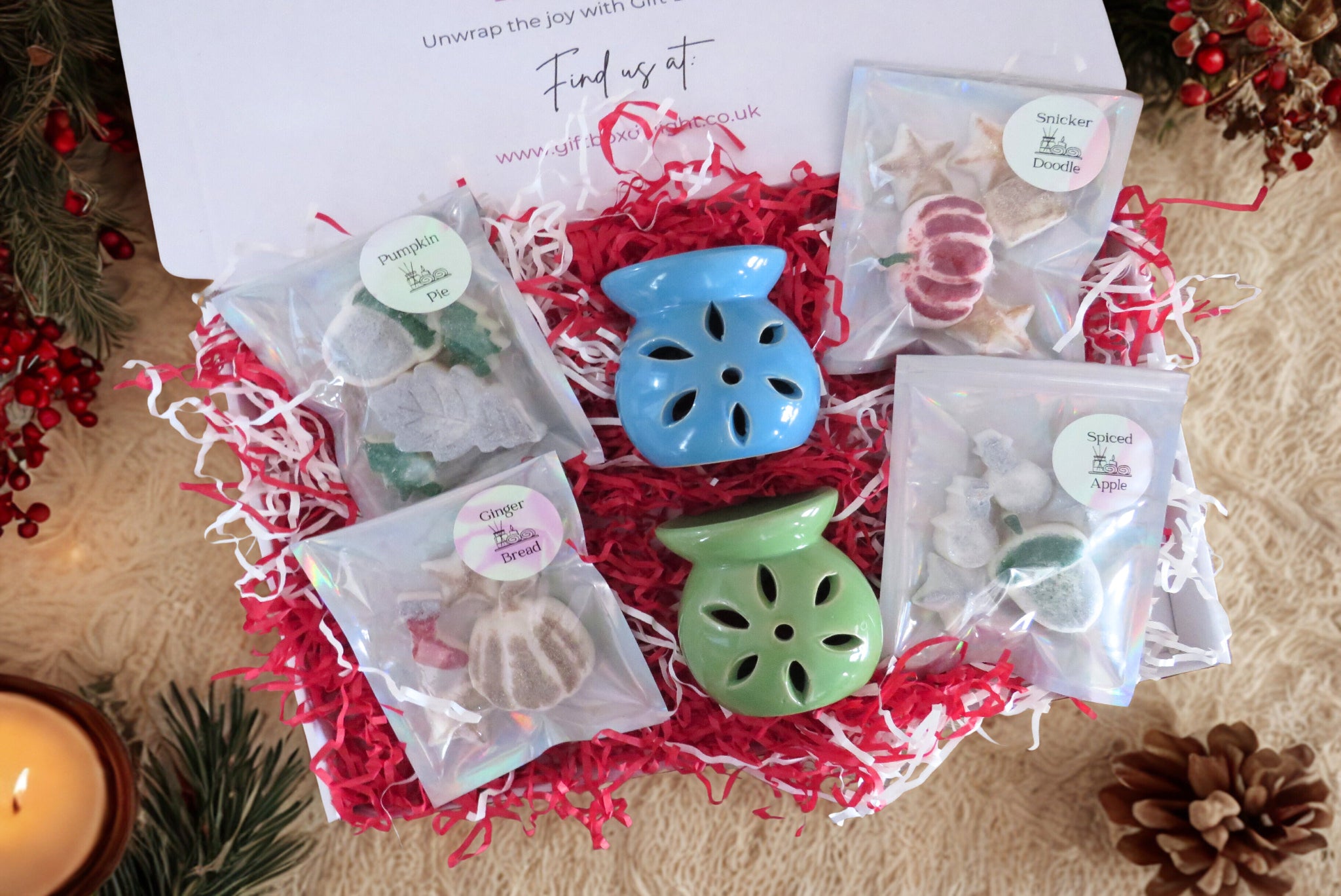 A Christmas box with scented wax melts & 2 wax burners.