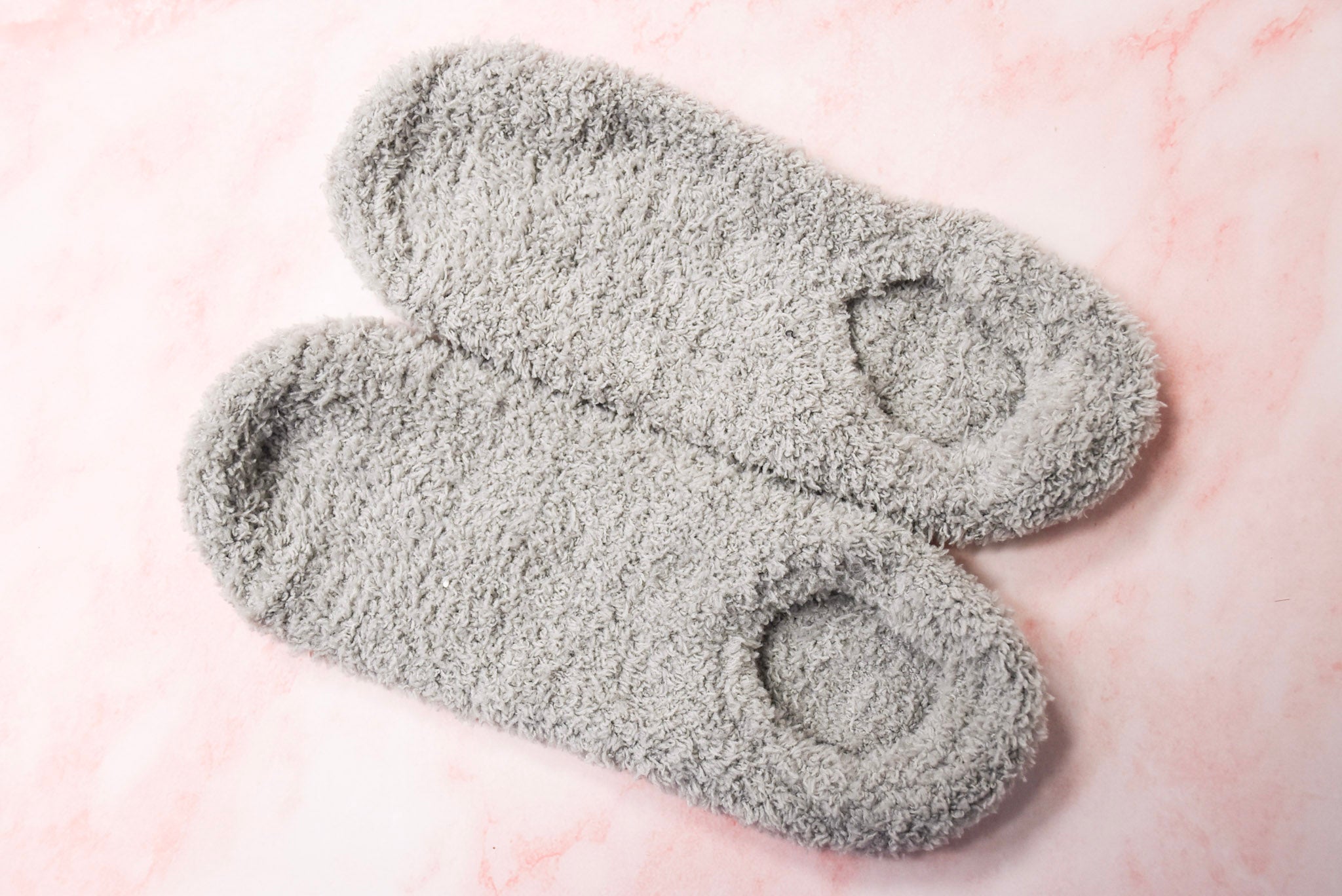 A pair of grey slipper socks.