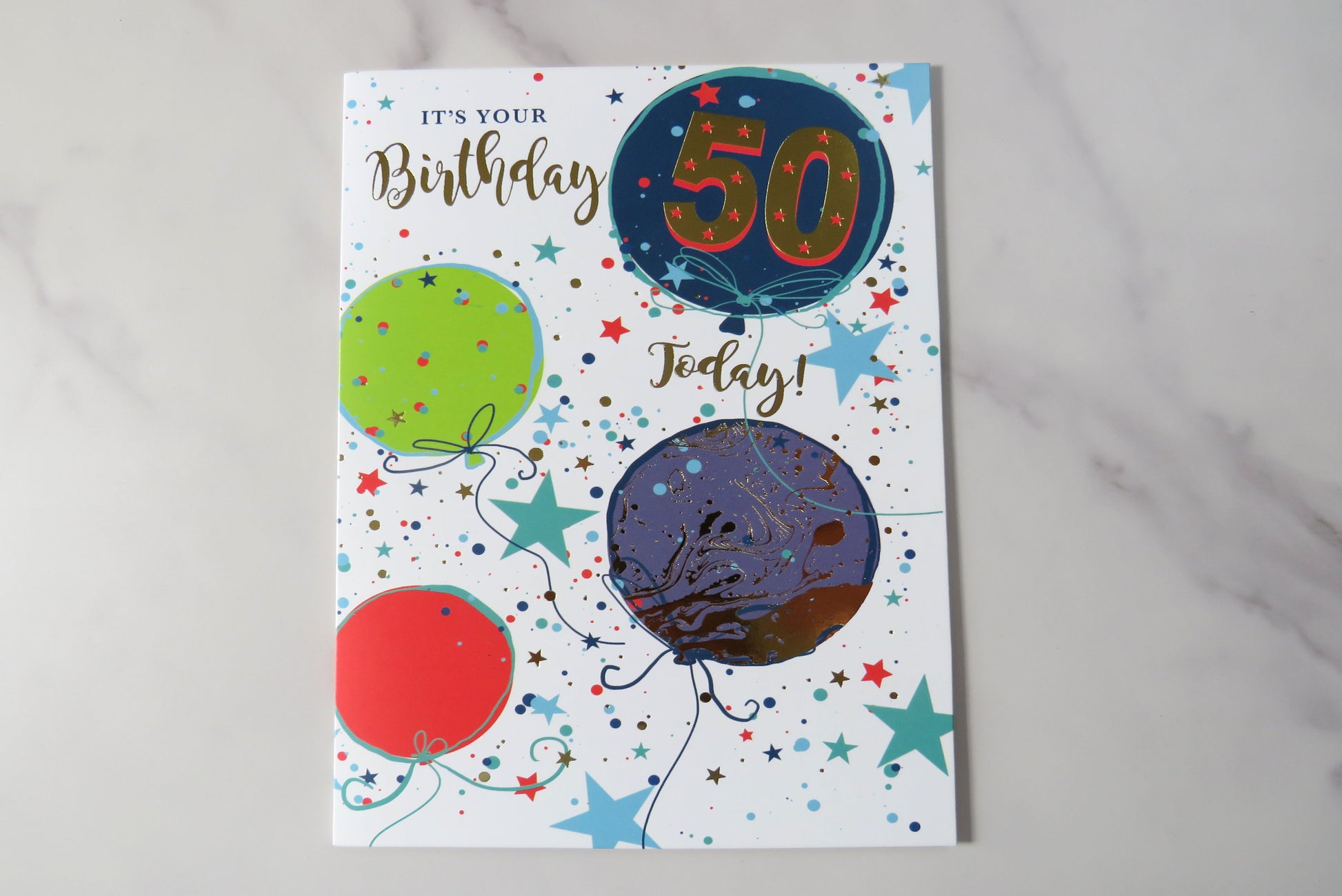 A colorful birthday card with balloons and the number 50 prominently displayed, along with the text 'It's your Birthday Today!'.