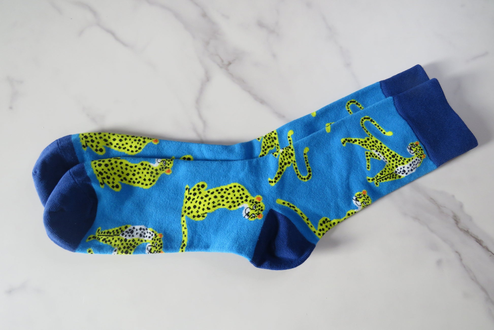 Blue men's socks with leopards.