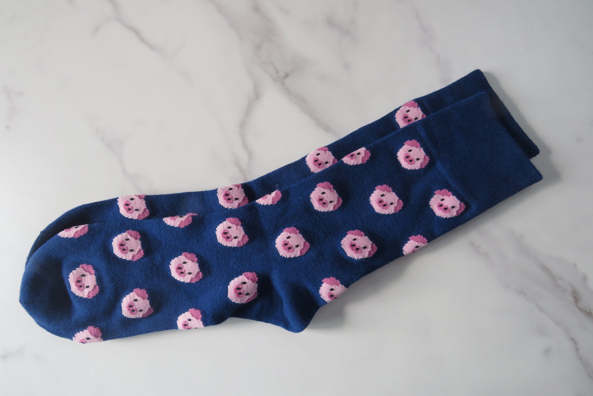 navy blue women's socks with pig faces on.