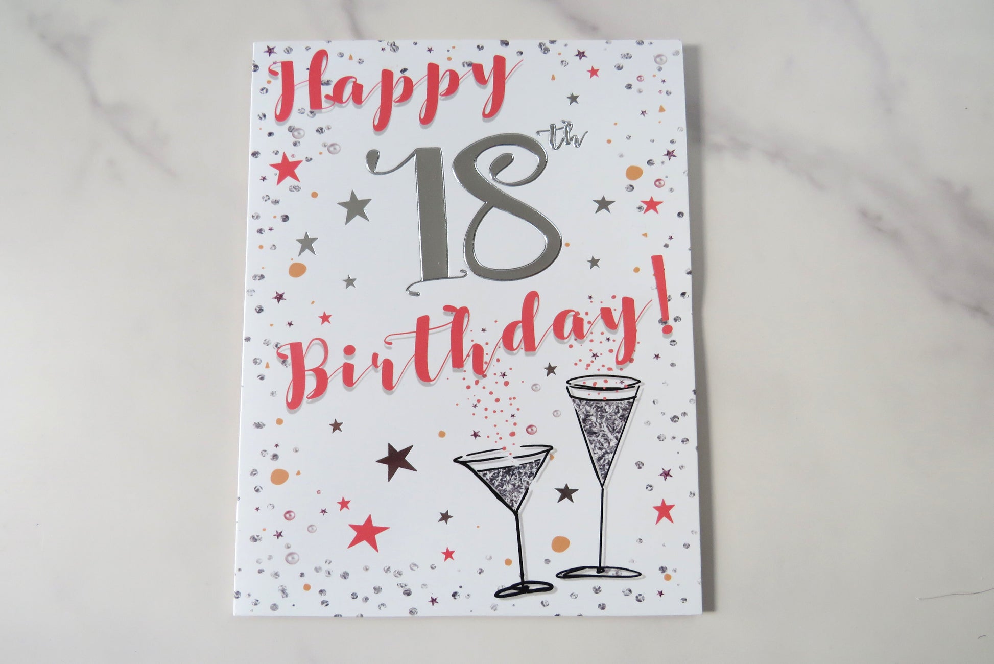 Happy 18th Birthday card with champagne glasses.