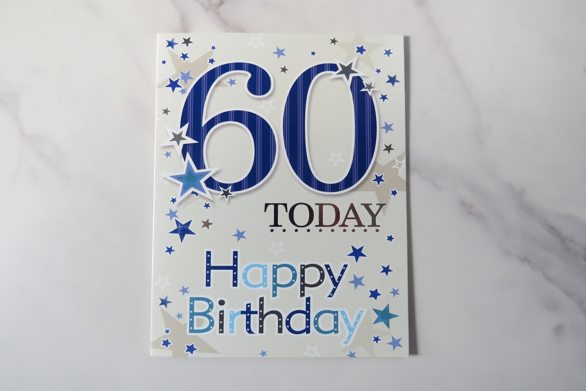 60th birthday card with blue text on.