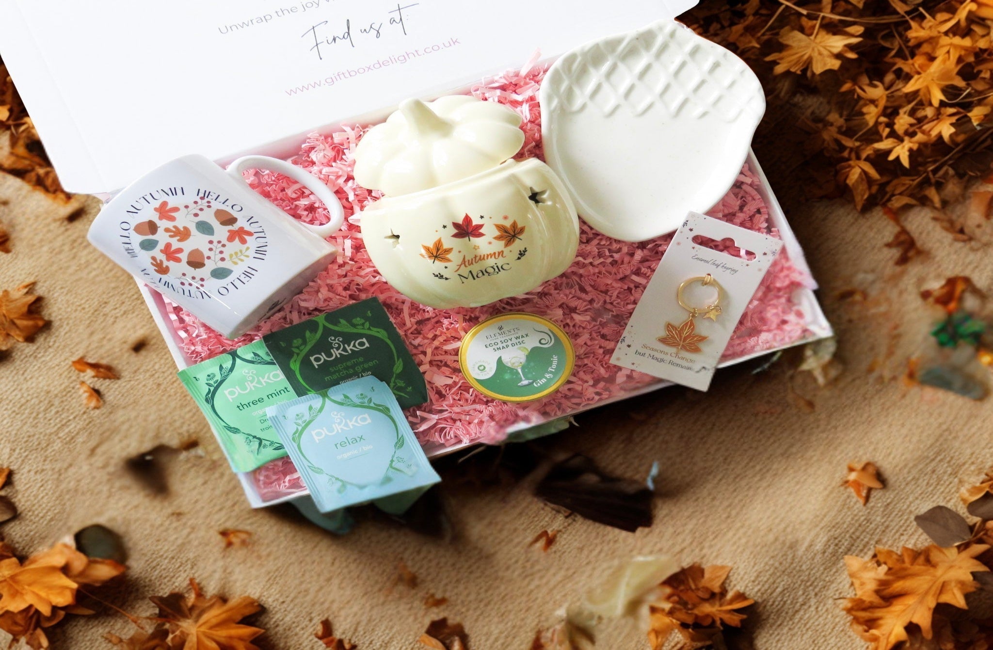Gift set with hello autumn mug, autumn magic ceramic oil/wax burner, acorn ceramic dish, Pukka tea bag selection, gin & tonic scented soy wax melt & autumn leaf keyring.
