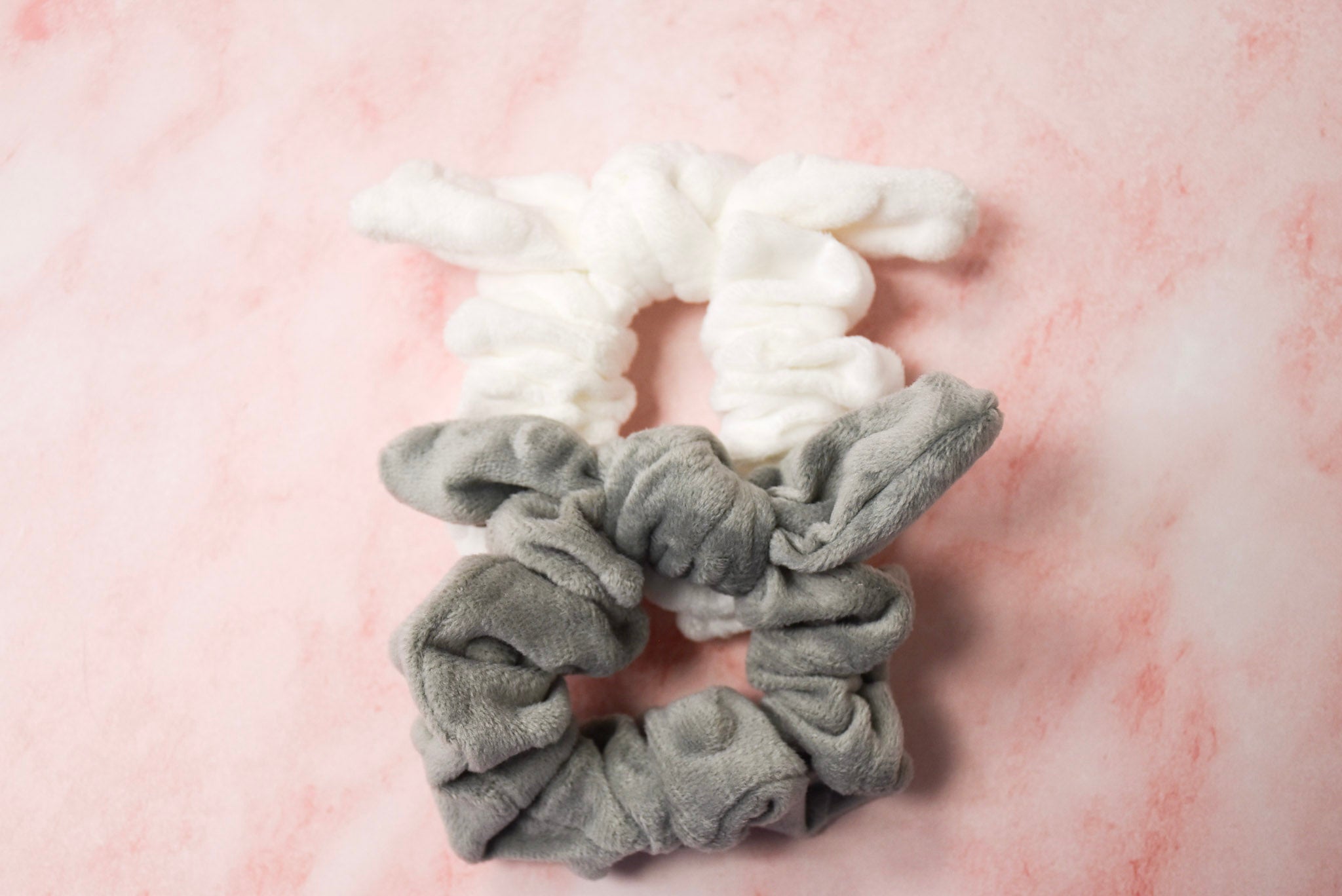 Two grey soft bow hair scrunchies.