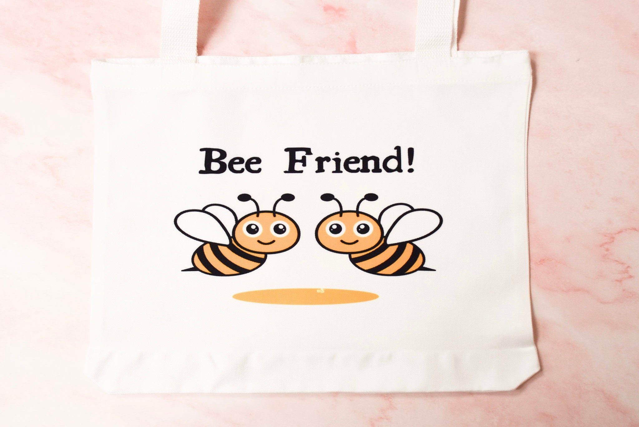 tote bag with cartoon bees and 'Bee Friend!' text.